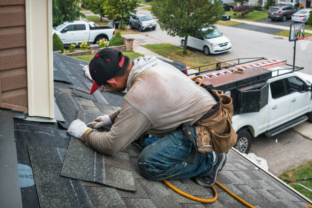 Professional Roofing technician working in Aston, PA